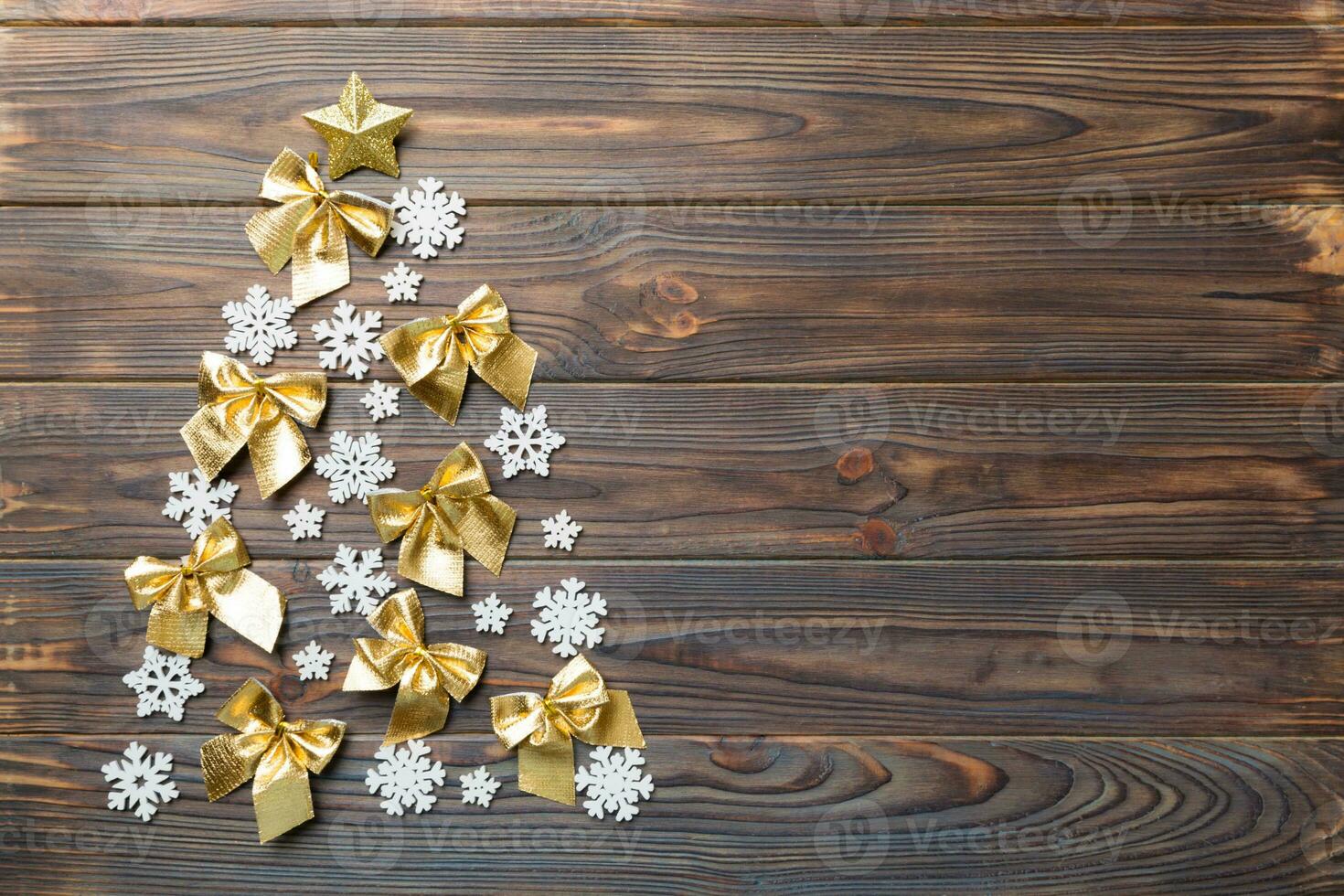 Christmas tree made from colored ball decoration on colored background, view from above. New Year minimal concept with copy space photo