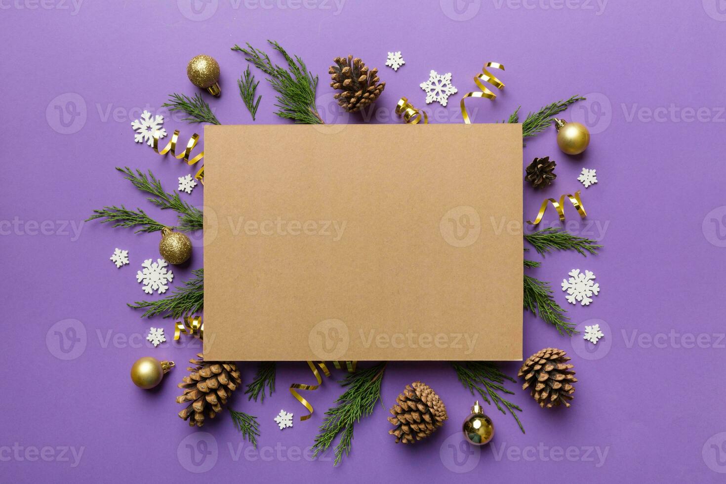 Flat lay Christmas composition. square Paper blank, pine tree branches, christmas decorations on Colored background. Top view, copy space for text photo