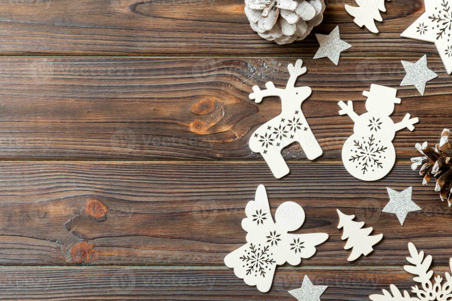 Top view of Christmas decorations and toys on wooden background. Copy space. Empty place for your design. New Year concept photo
