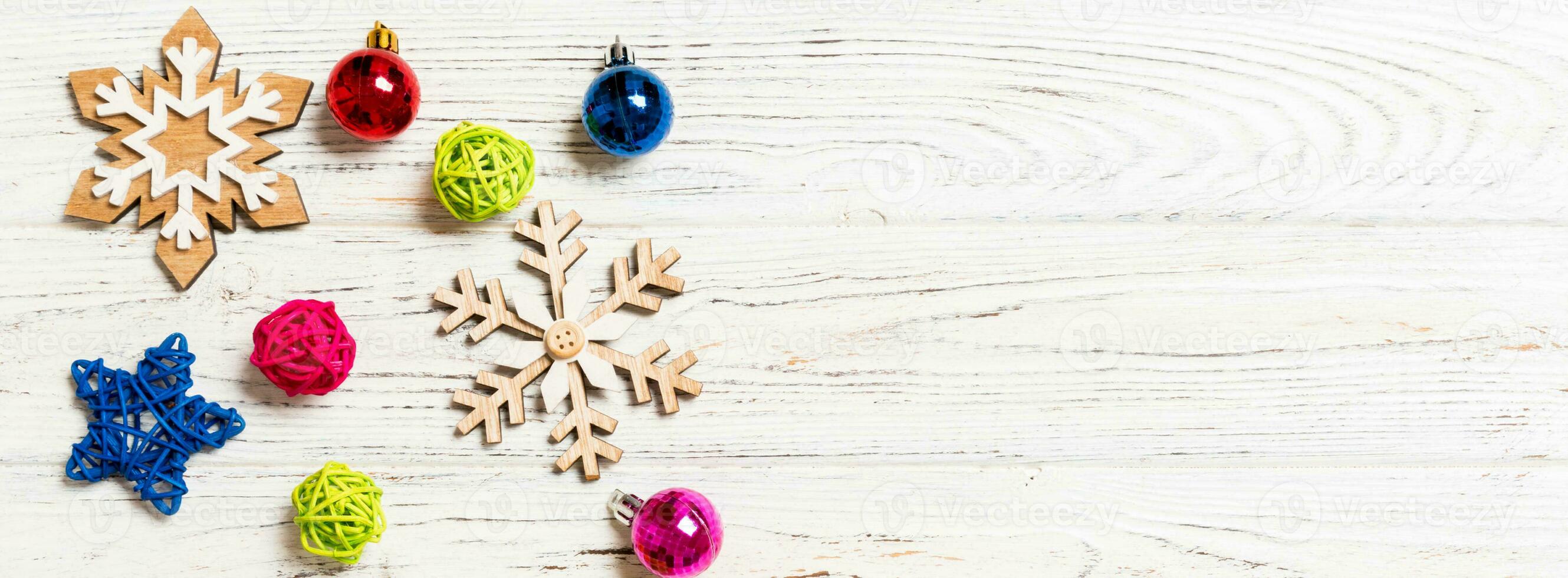 Top view of Christmas decorations and toys on wooden background. Copy space. Empty place for your design. Banner New Year concept photo