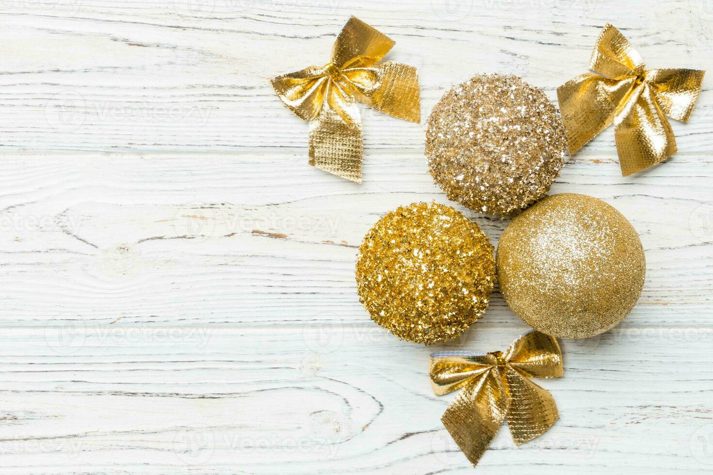 Creative set of New Year baubles and decorations on wooden background. Top view of Christmas time concept. Copy space photo