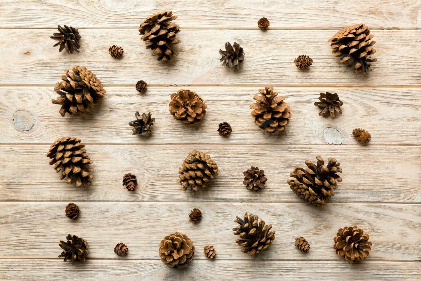 pine cones on colored table. natural holiday background with pinecones grouped together. Flat lay. Winter concept photo