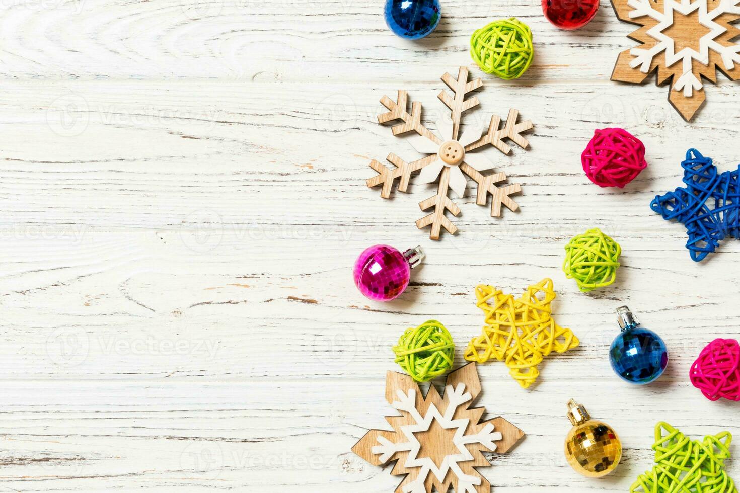 Top view of Christmas decorations and toys on wooden background. Copy space. Empty place for your design. New Year concept photo
