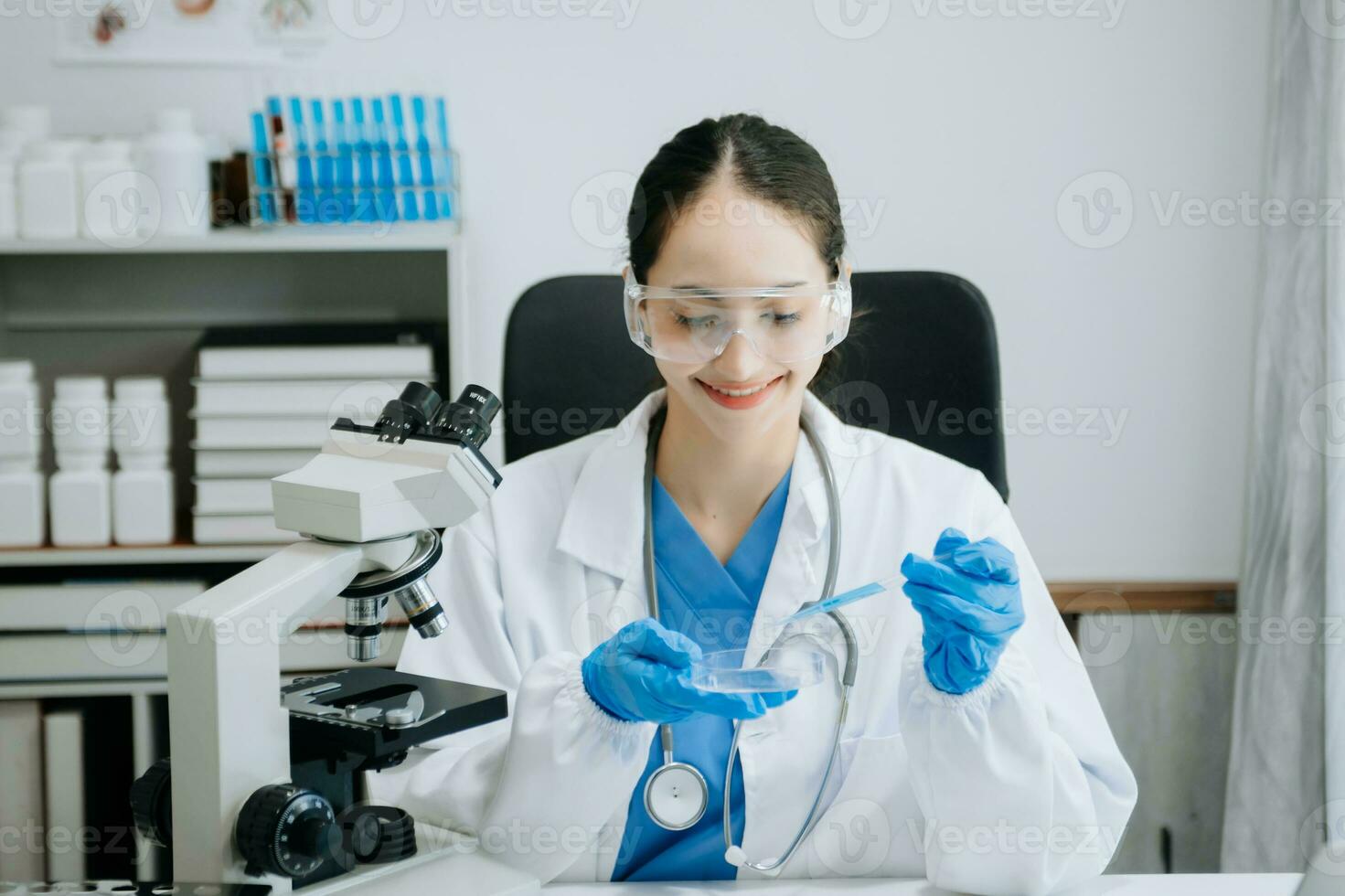 female scientist working with micro pipettes analyzing biochemical samples, advanced science chemical laboratory for medicine. photo