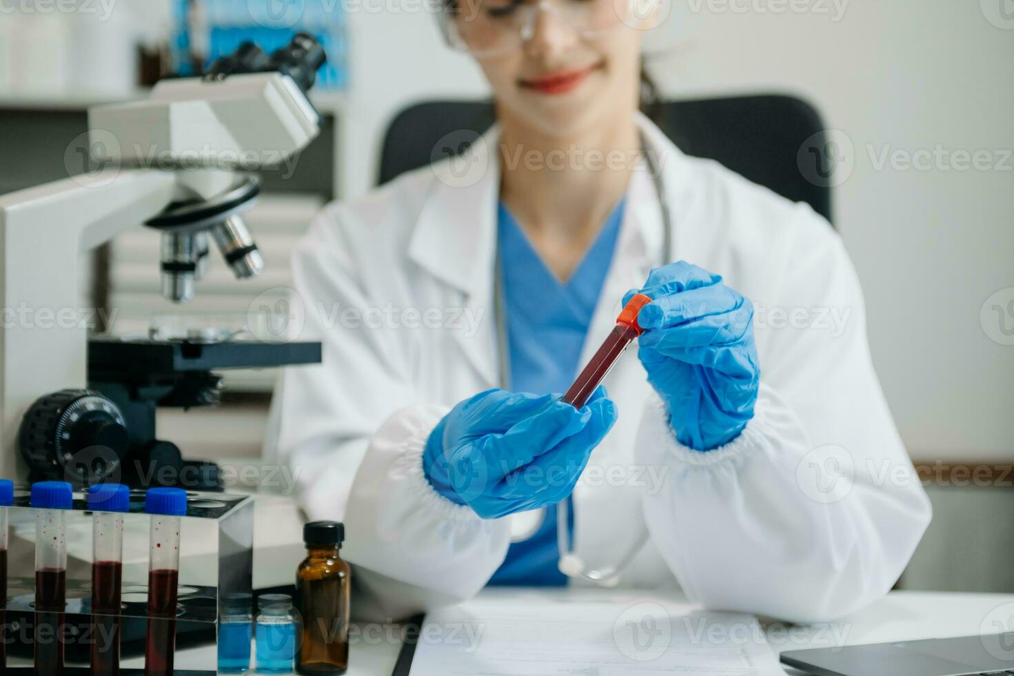 female scientist working with micro pipettes analyzing biochemical samples, advanced science chemical laboratory for medicine. photo