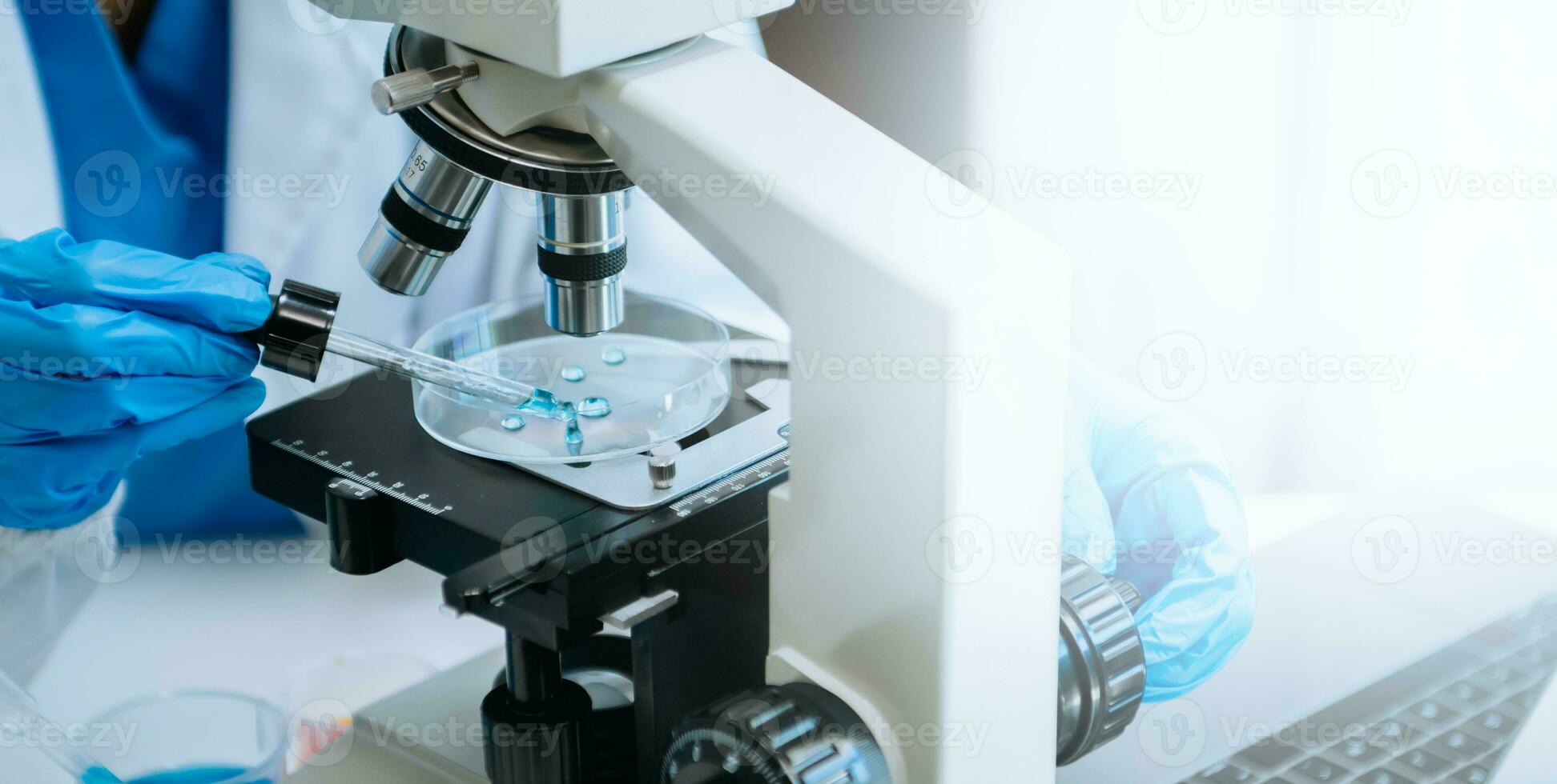 Modern medical research laboratory. female scientist working with micro pipettes analyzing biochemical samples, advanced science chemical laboratory photo