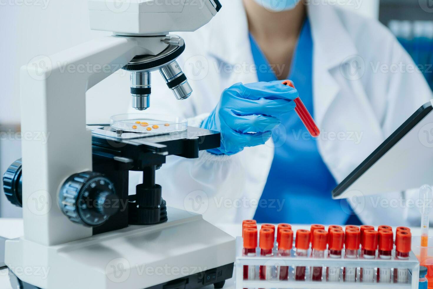 Modern medical research laboratory. female scientist working with micro pipettes analyzing biochemical samples, advanced science chemical laboratory photo