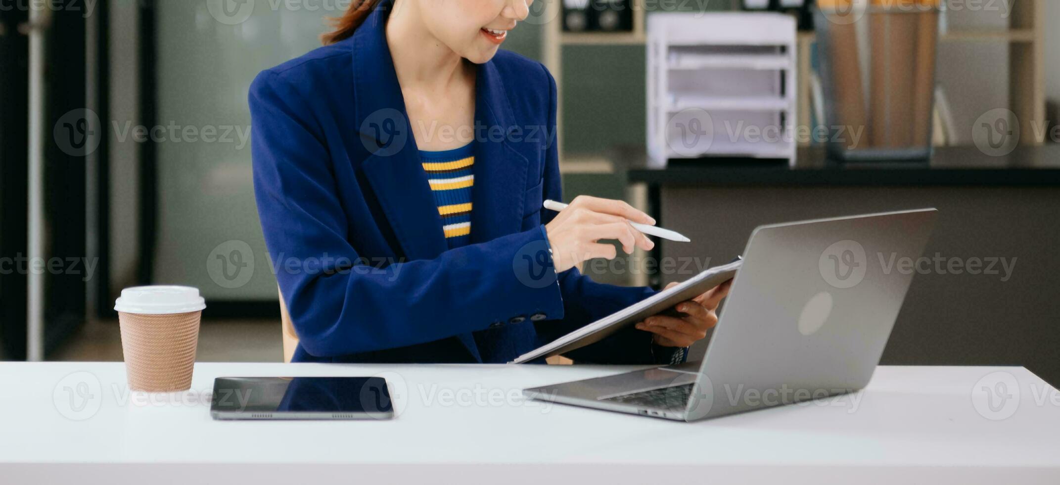 Working Process in Modern Office. Young Woman Account Manager Working at Table with New Business Project. Typing keyboard Laptop. Horizontal. photo