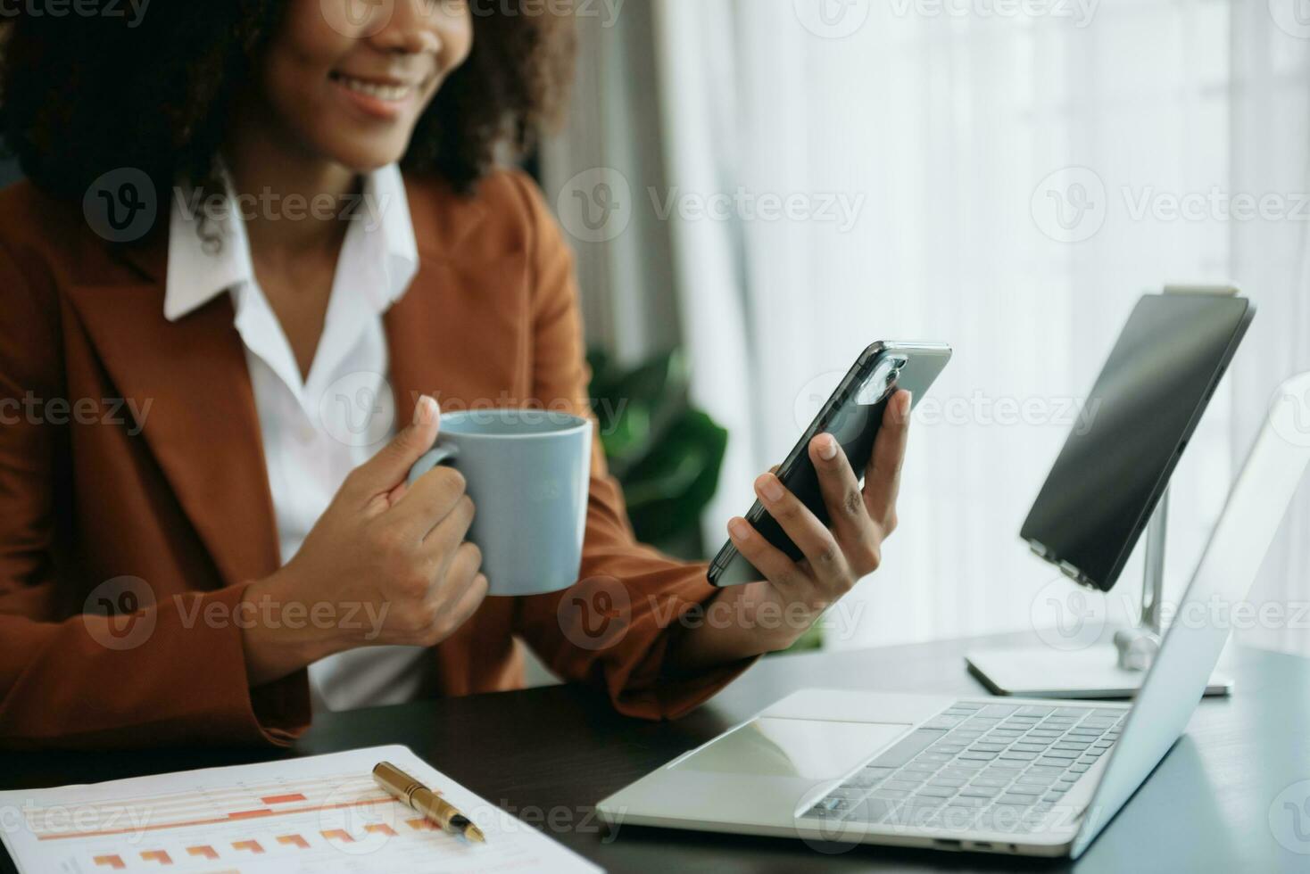 African businesswoman hand working with new modern computer using on smartphone and tablet as concept photo