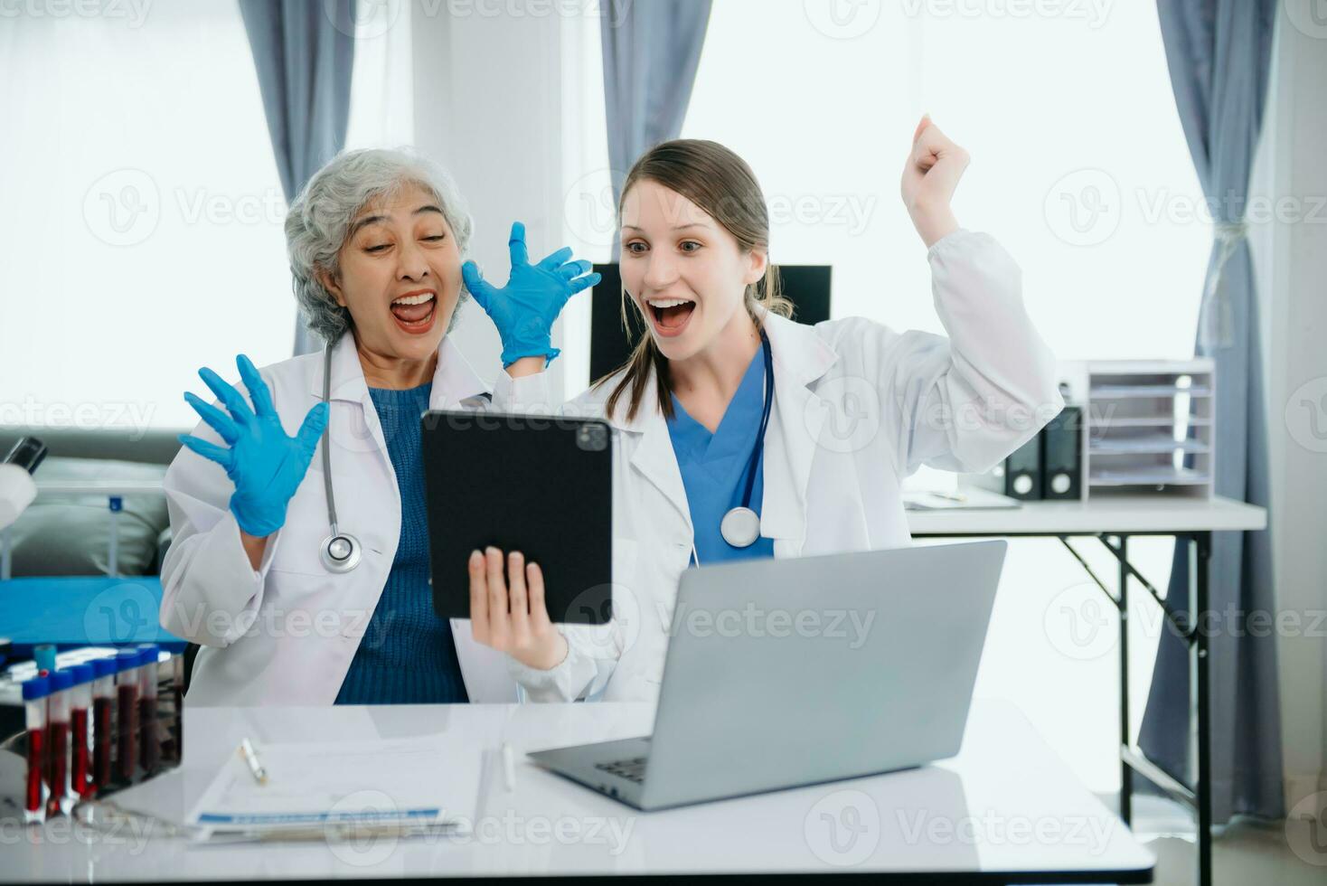 Hospital Ward. Doctor Talks With Professional Head Nurse or Surgeon, They Use Digital tablet Computer. Diverse Team of Health Care Specialists Discussing Test Result photo