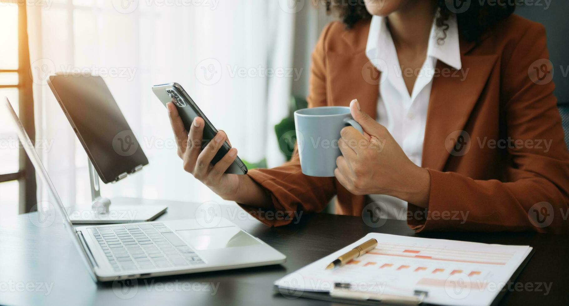 African businesswoman hand working with new modern computer using on smartphone and tablet as concept photo