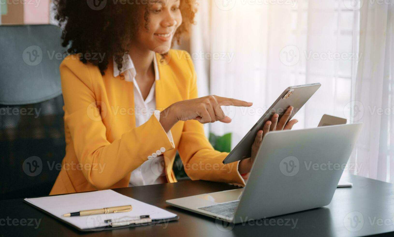 African businesswoman hand working with new modern computer using on smartphone and tablet as concept photo