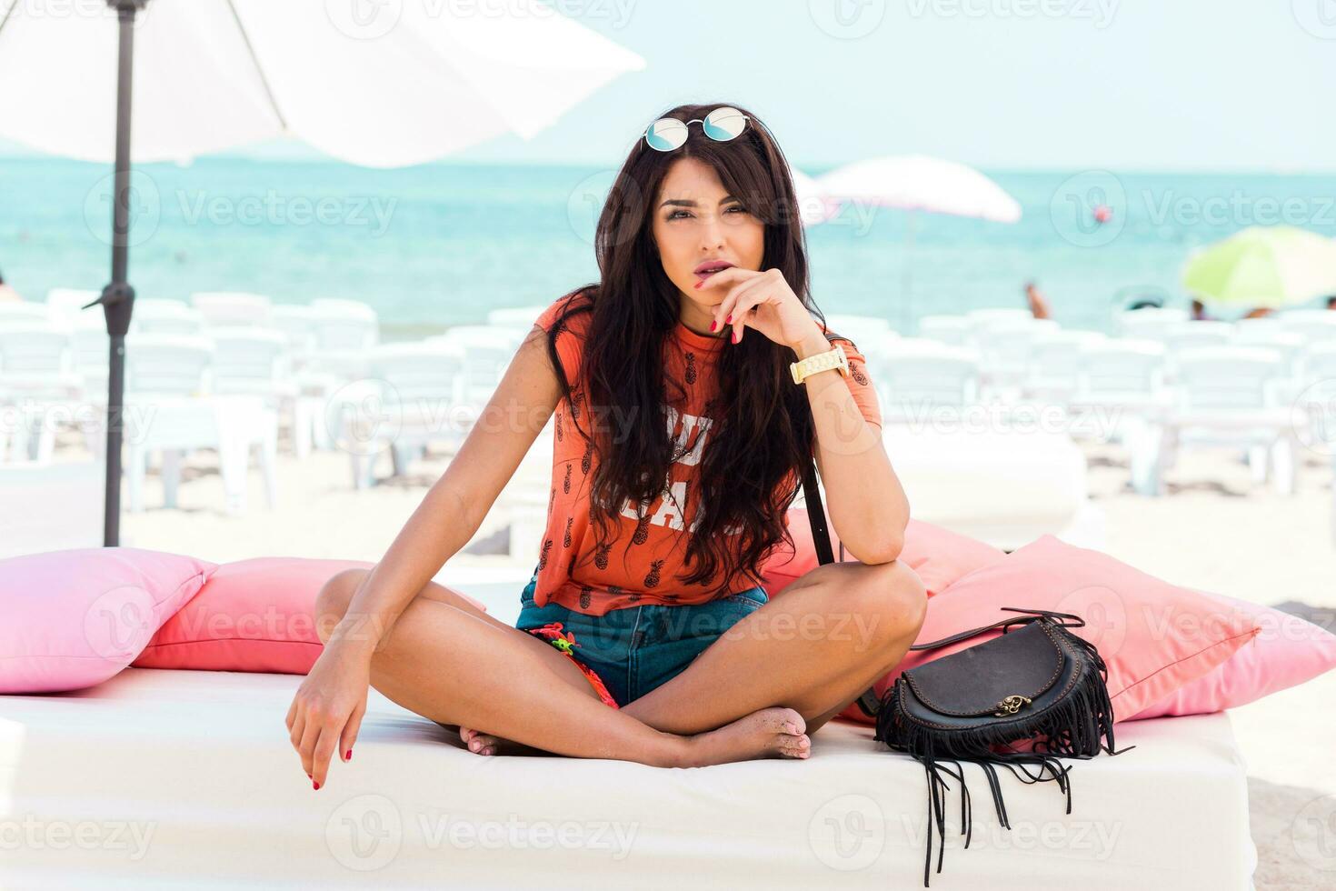 Outdoor   lifestyle  portrait of young amazing brunette woman , orange print t-shirt . photo
