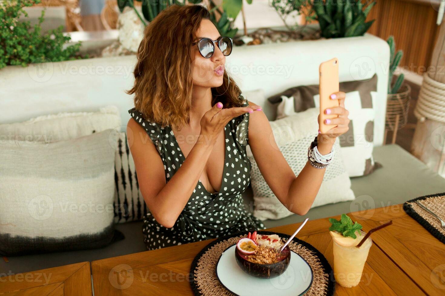 Woman in stylish dress posing outdoor photo