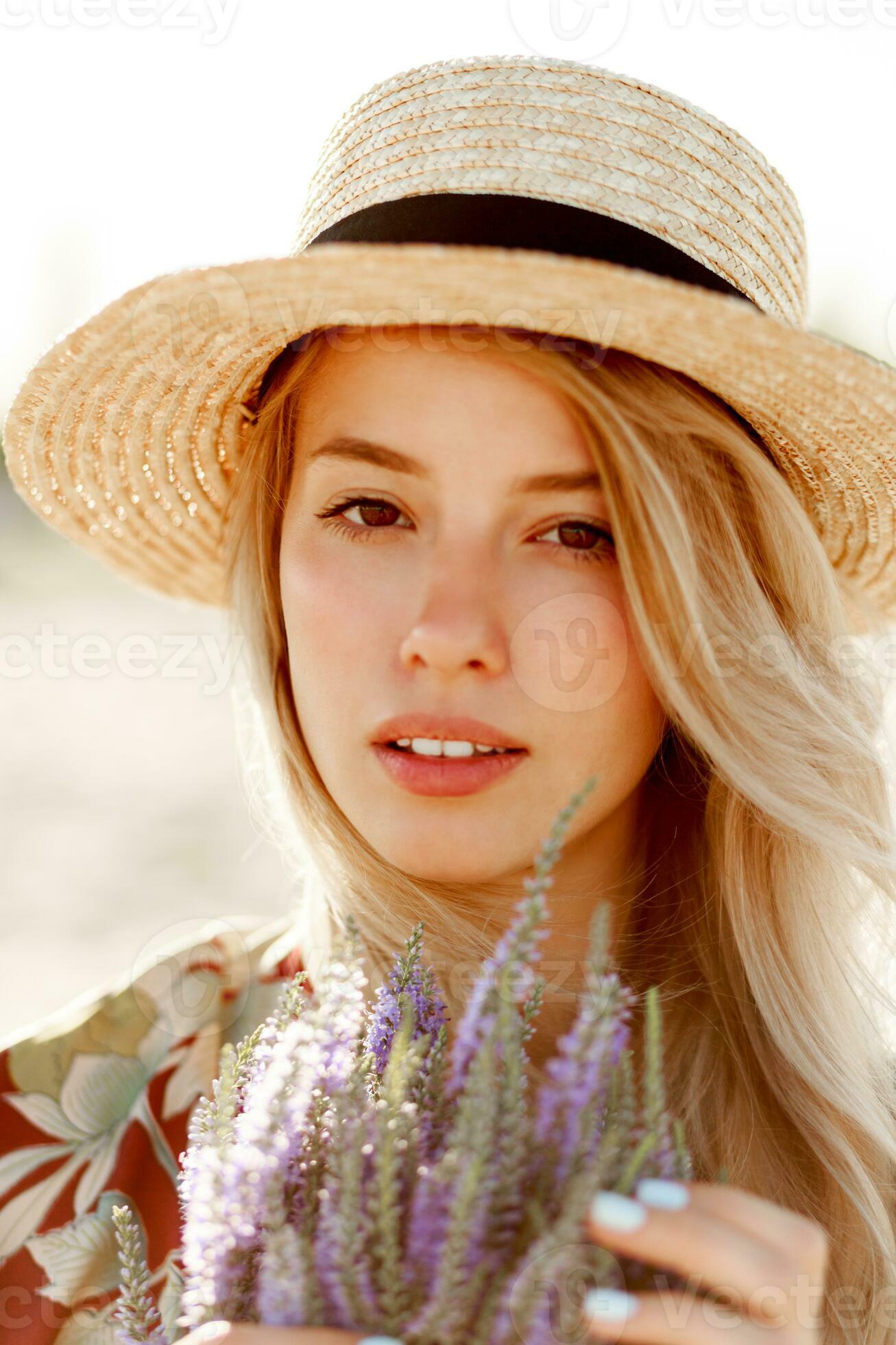 Romantic happy close up portrait of charming blonde girl in straw hat
