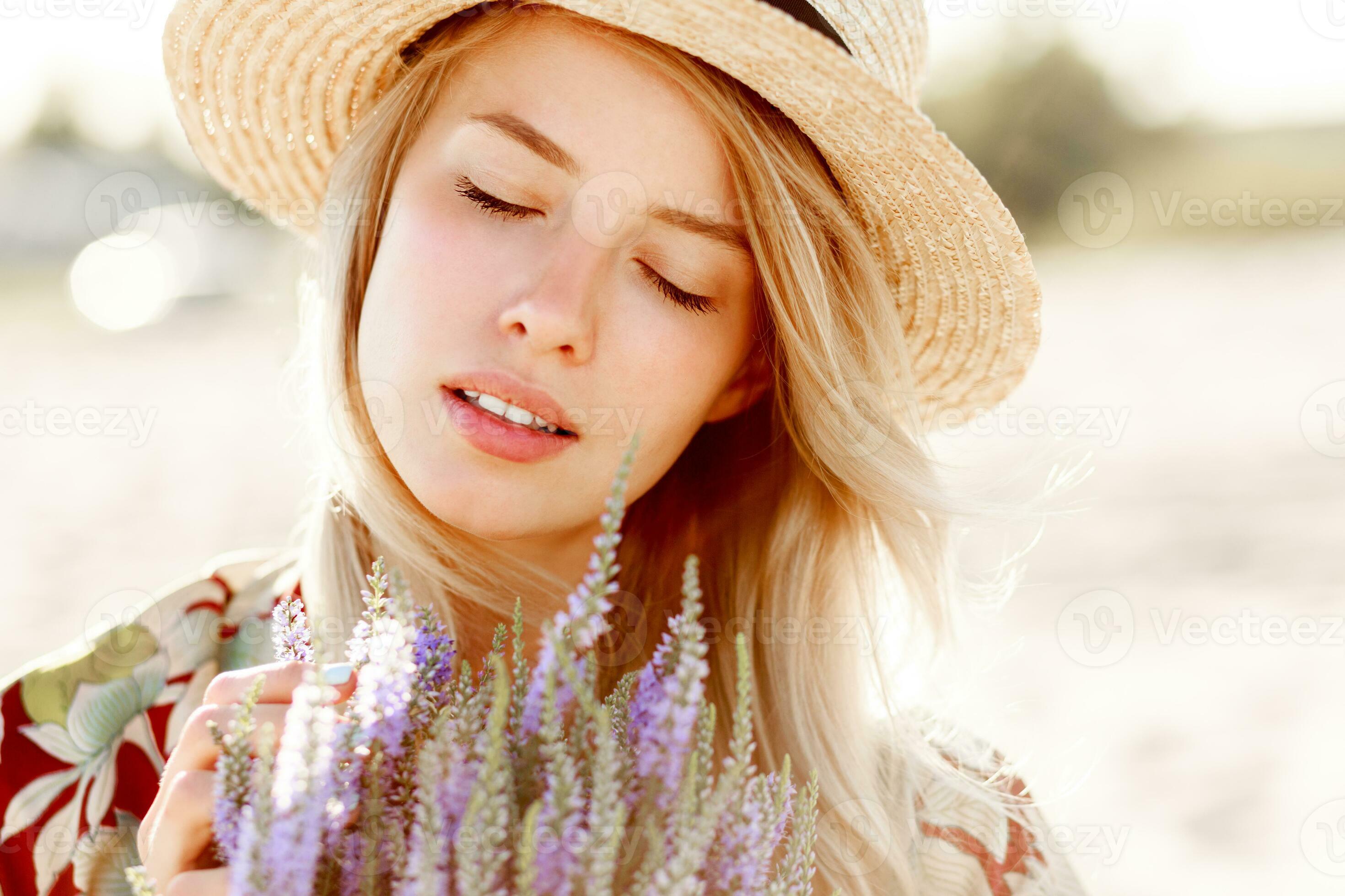 Romantic happy close up portrait of charming blonde girl in straw hat