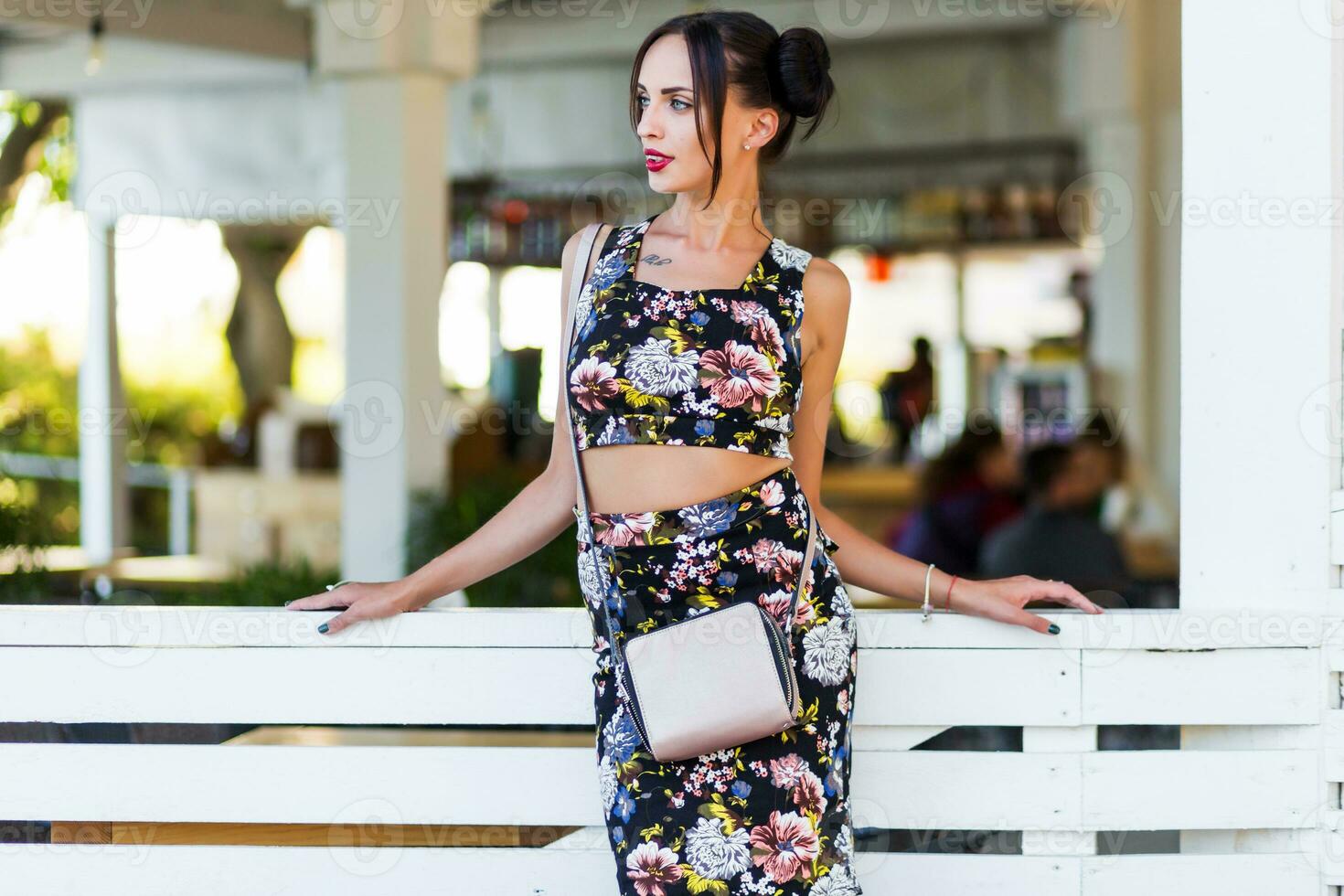 Pretty brunette woman posing  outdoor in sunny summer day. photo