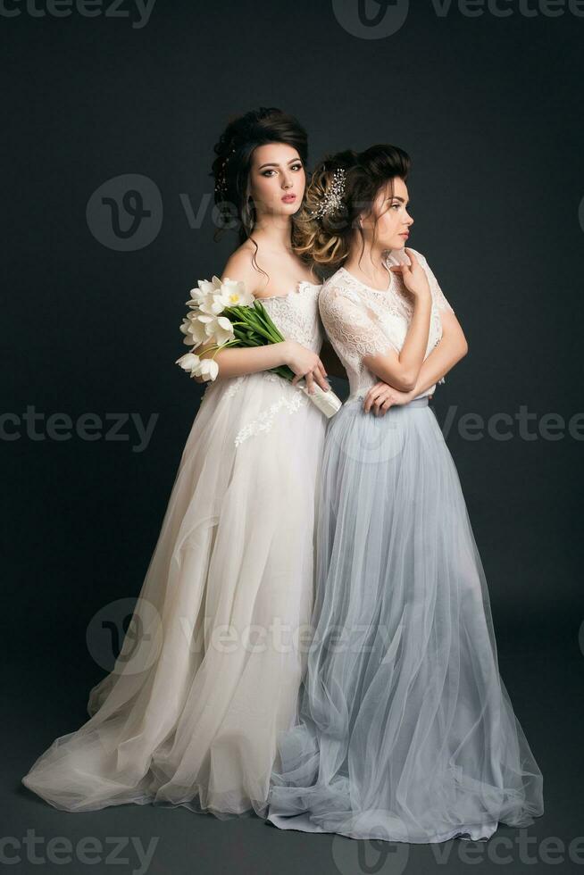 two young beautiful stylish women, bride, bridal fashion photo