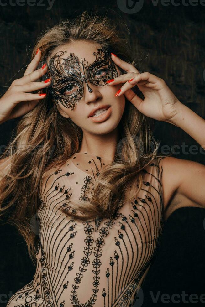 beautiful woman in carnival mask photo