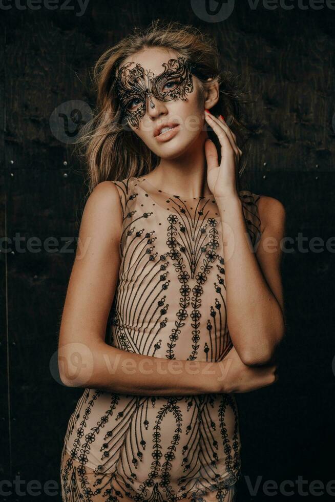 beautiful woman in carnival mask photo
