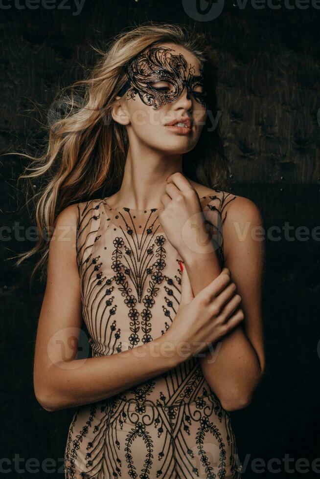 beautiful woman in carnival mask photo