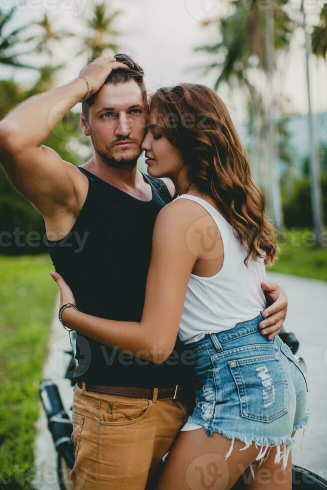 young couple in love, riding a motorcycle, hug, passion, free spirit photo