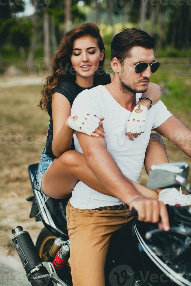 young couple in love, riding a motorcycle, hug, passion, free spirit photo