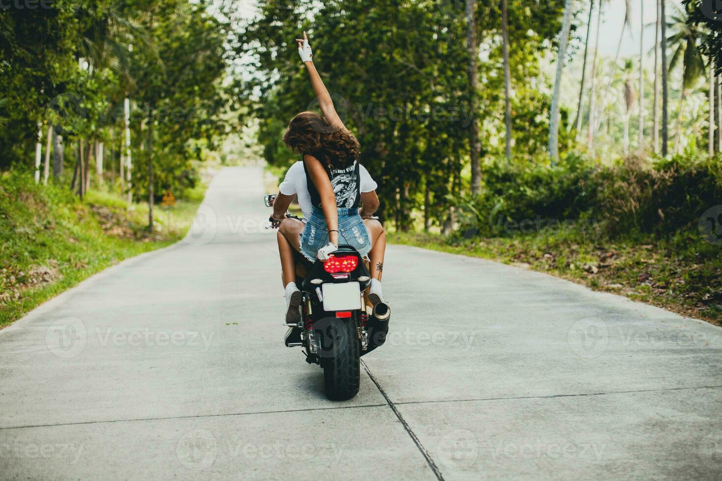 young couple in love, riding a motorcycle, hug, passion, free spirit photo