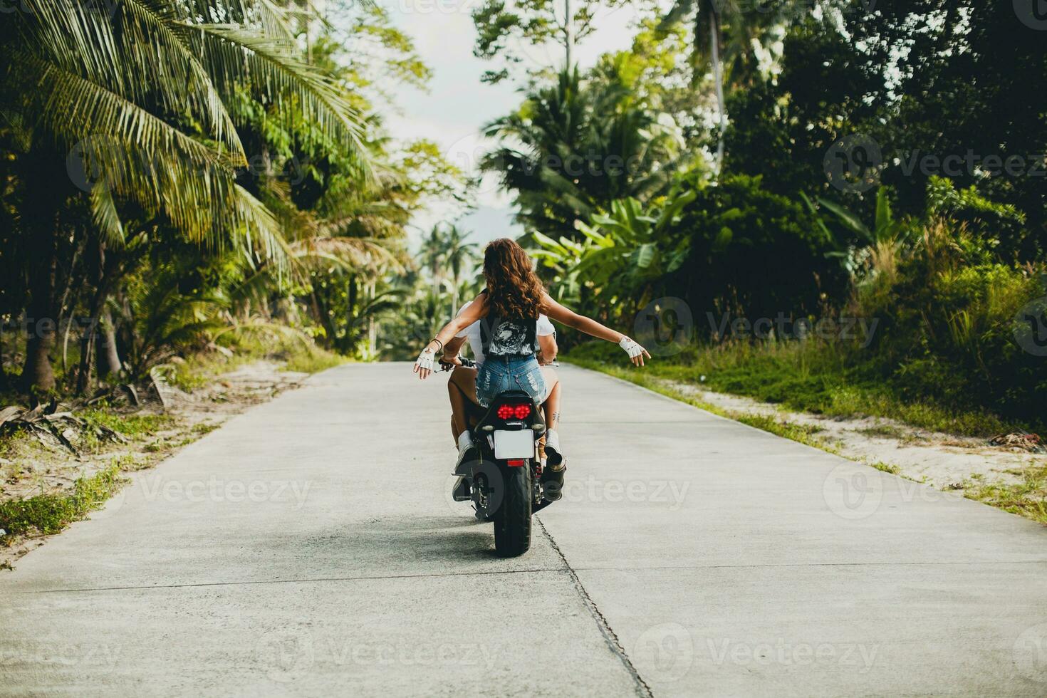 young couple in love, riding a motorcycle, hug, passion, free spirit photo