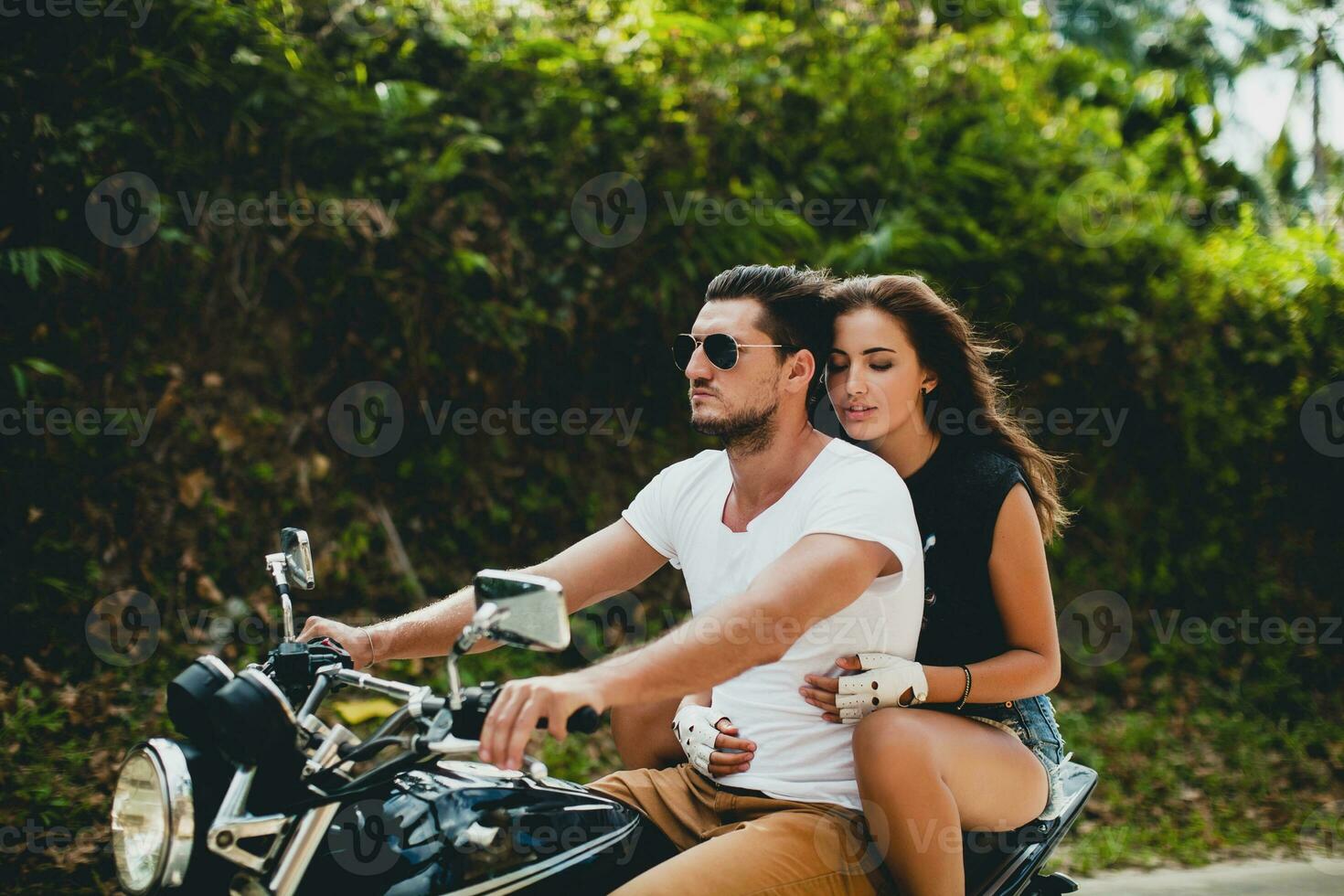 young couple in love, riding a motorcycle, hug, passion, free spirit photo