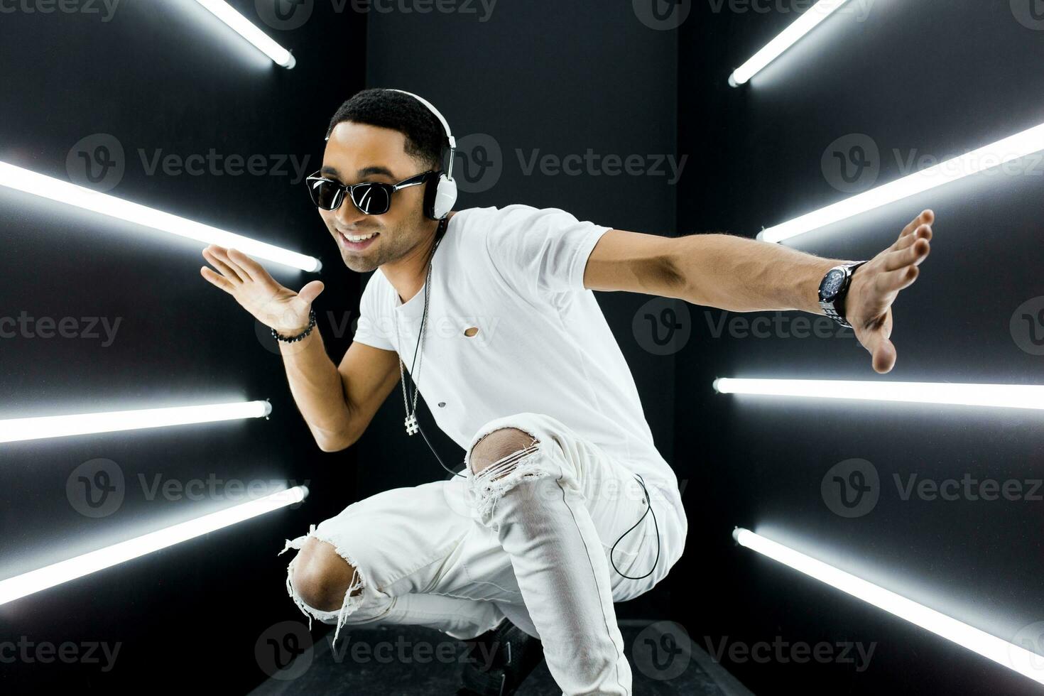 black man dancing in neon lights photo