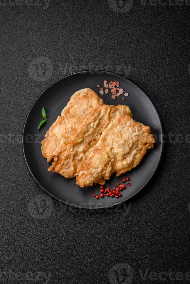 Delicious fried chicken chop or pork meat fried breaded with salt, spices and herbs photo