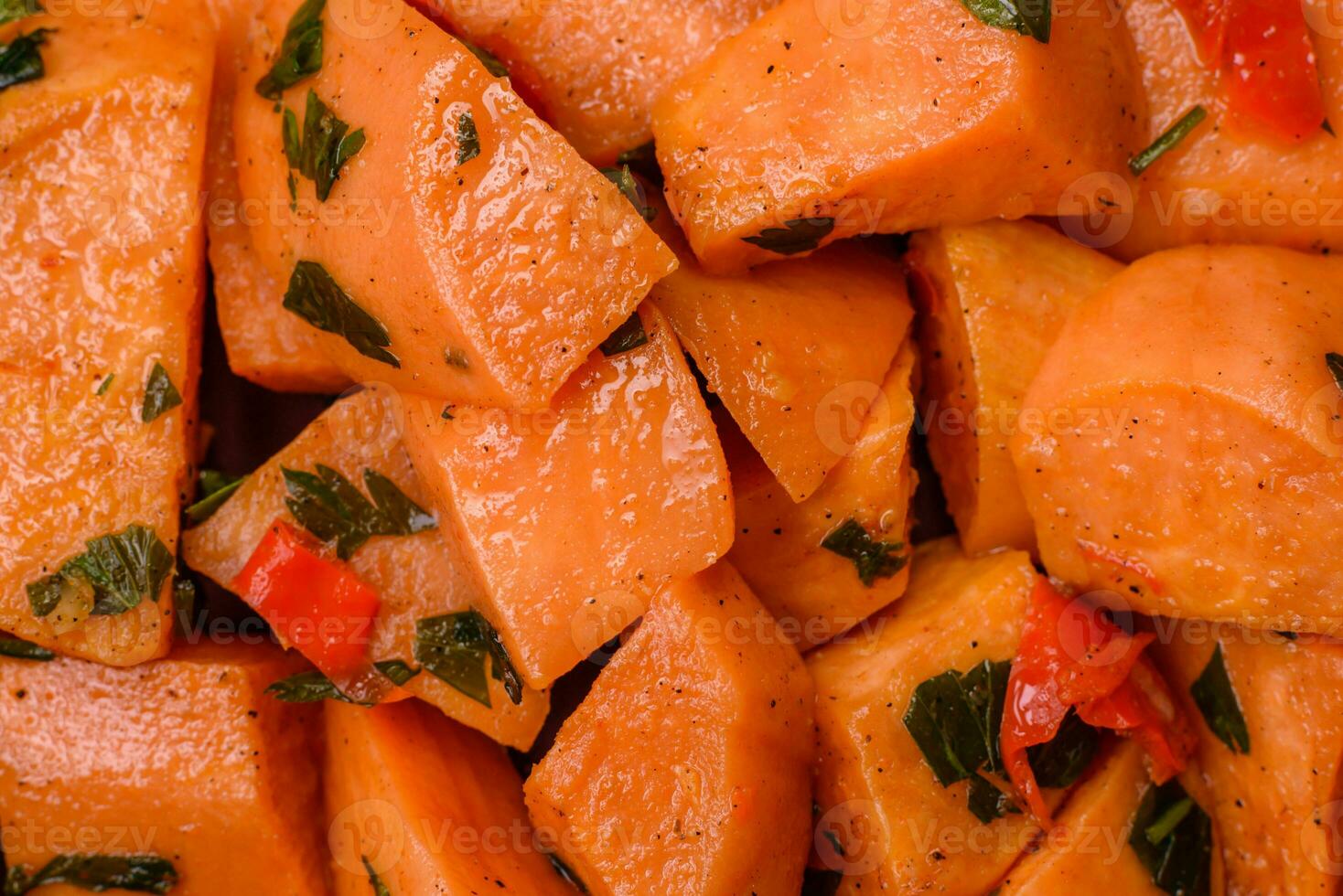 Delicious stewed sweet potato with salt, spices and herbs photo