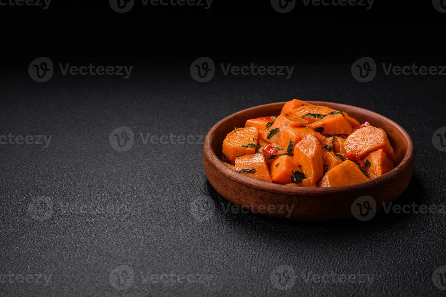 Delicious stewed sweet potato with salt, spices and herbs photo