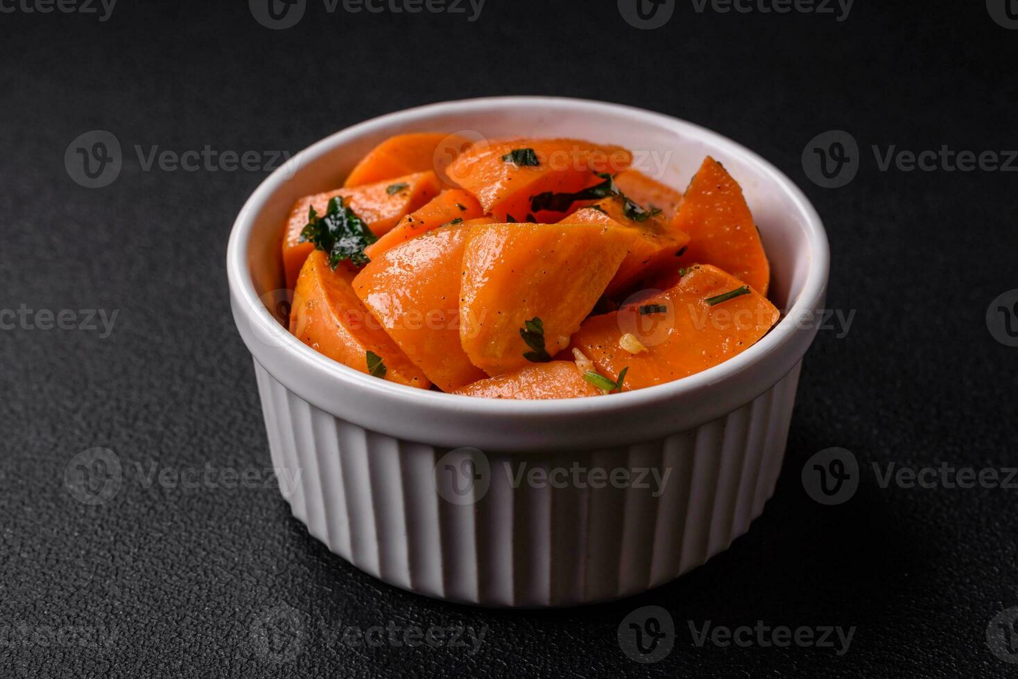 Delicious stewed sweet potato with salt, spices and herbs photo