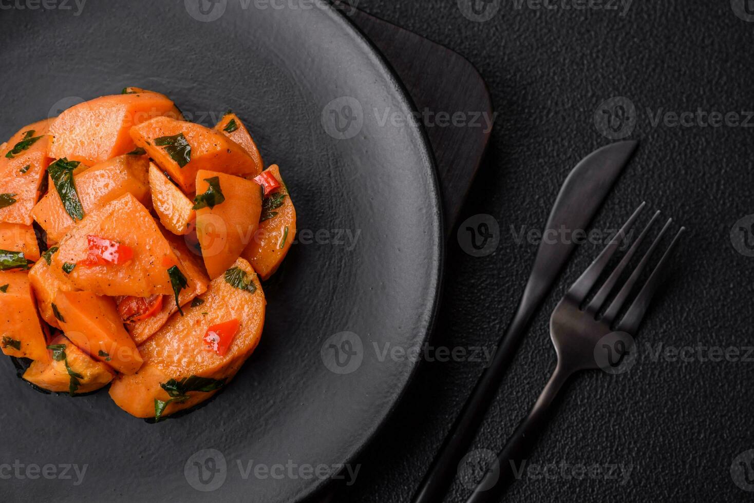 Delicious stewed sweet potato with salt, spices and herbs photo