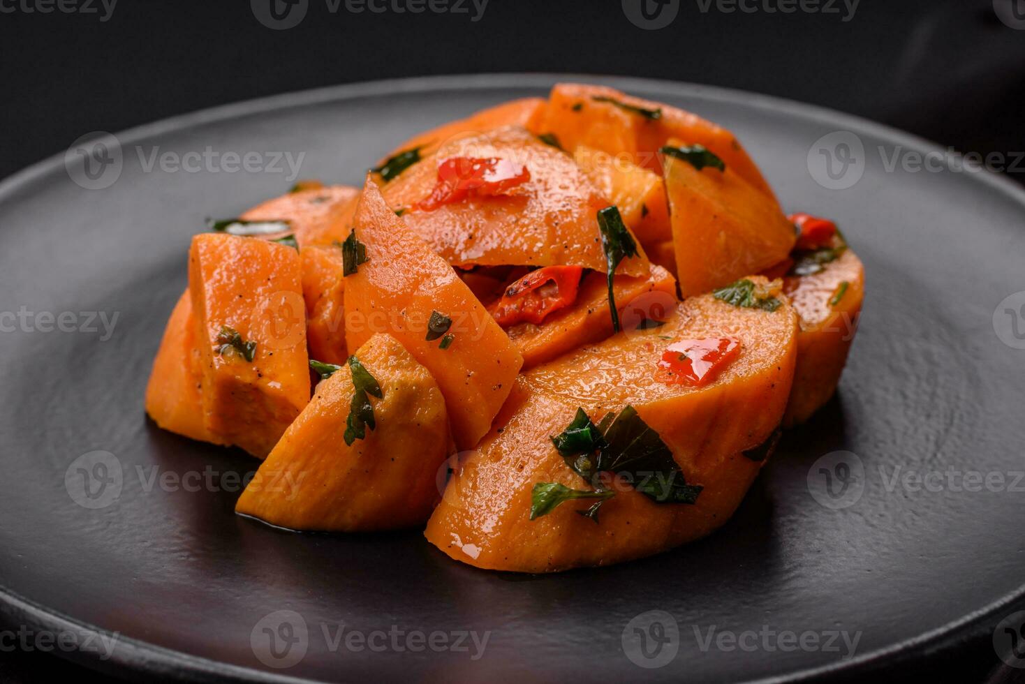 Delicious stewed sweet potato with salt, spices and herbs photo