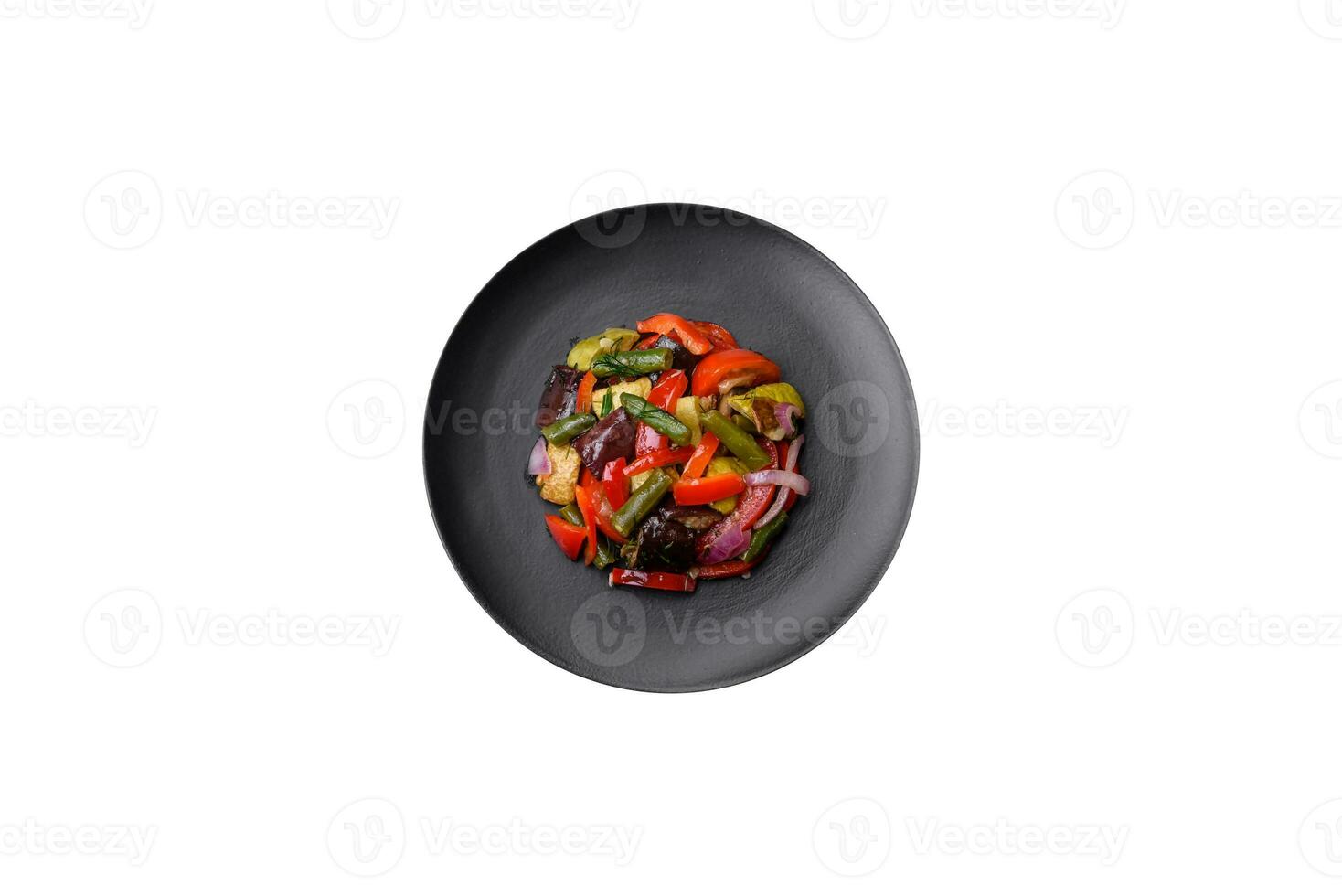 Delicious fresh salad of grilled vegetables peppers, tomatoes, eggplants and zucchini photo