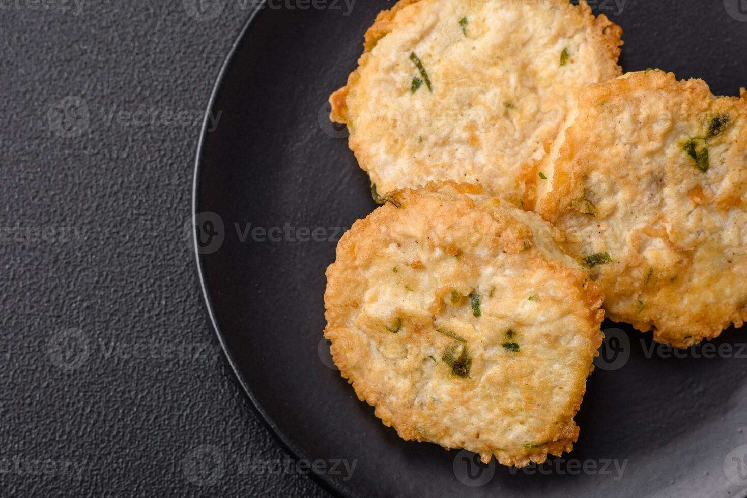 Delicious fried minced fish cutlets or meatballs with salt, spices and herbs photo