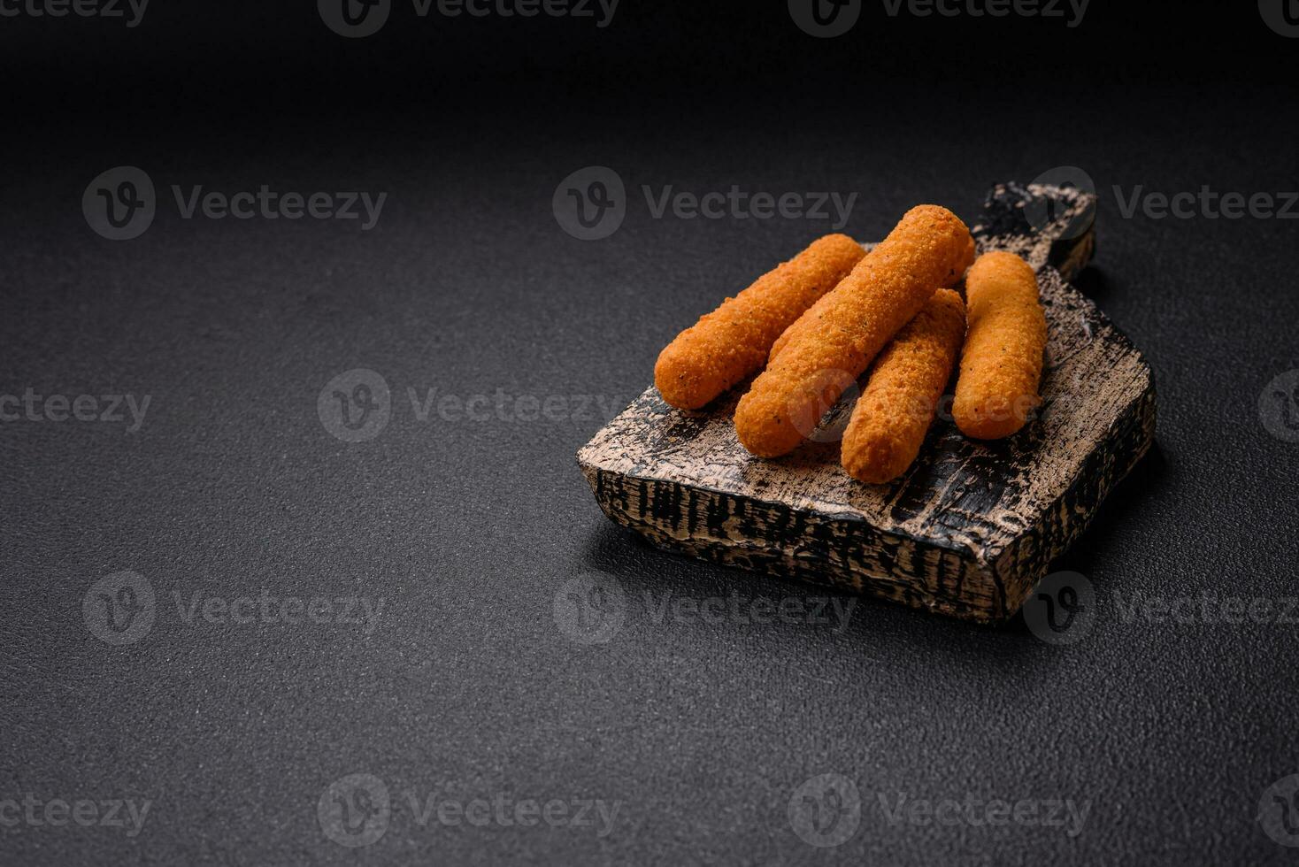 Delicious crispy cheese sticks with mozzarella, salt and spices, breaded and fried in oil photo