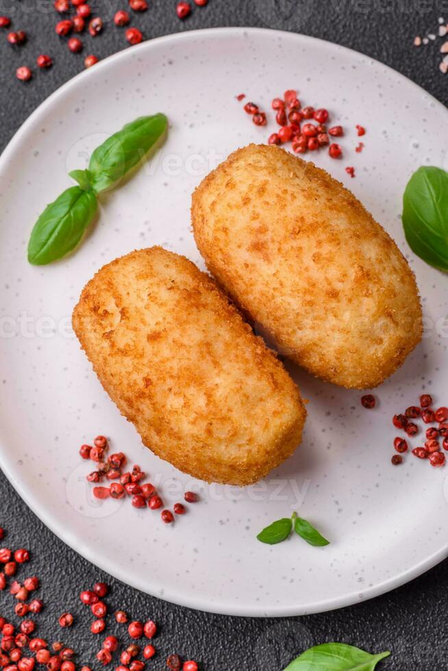 Delicious baked potato cutlet stuffed with chicken and vegetables, spices and salt photo