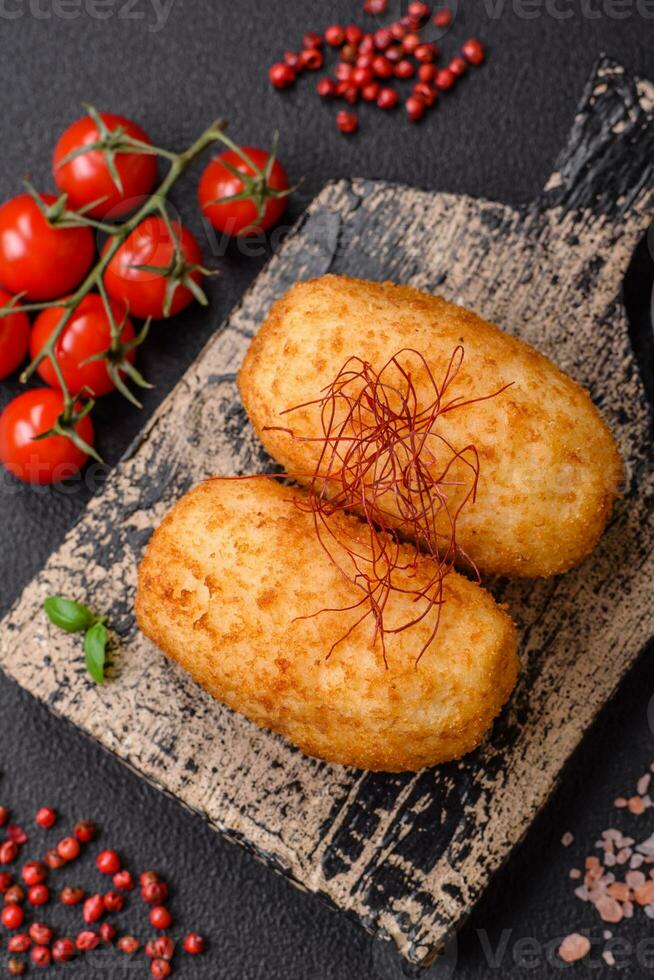 Delicious baked potato cutlet stuffed with chicken and vegetables, spices and salt photo