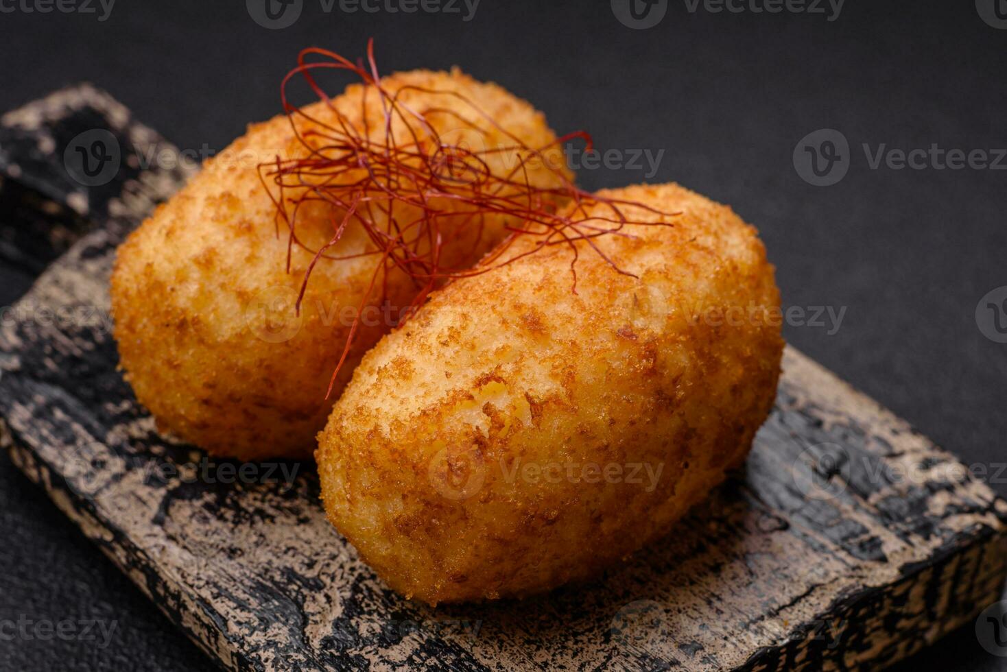 Delicious baked potato cutlet stuffed with chicken and vegetables, spices and salt photo