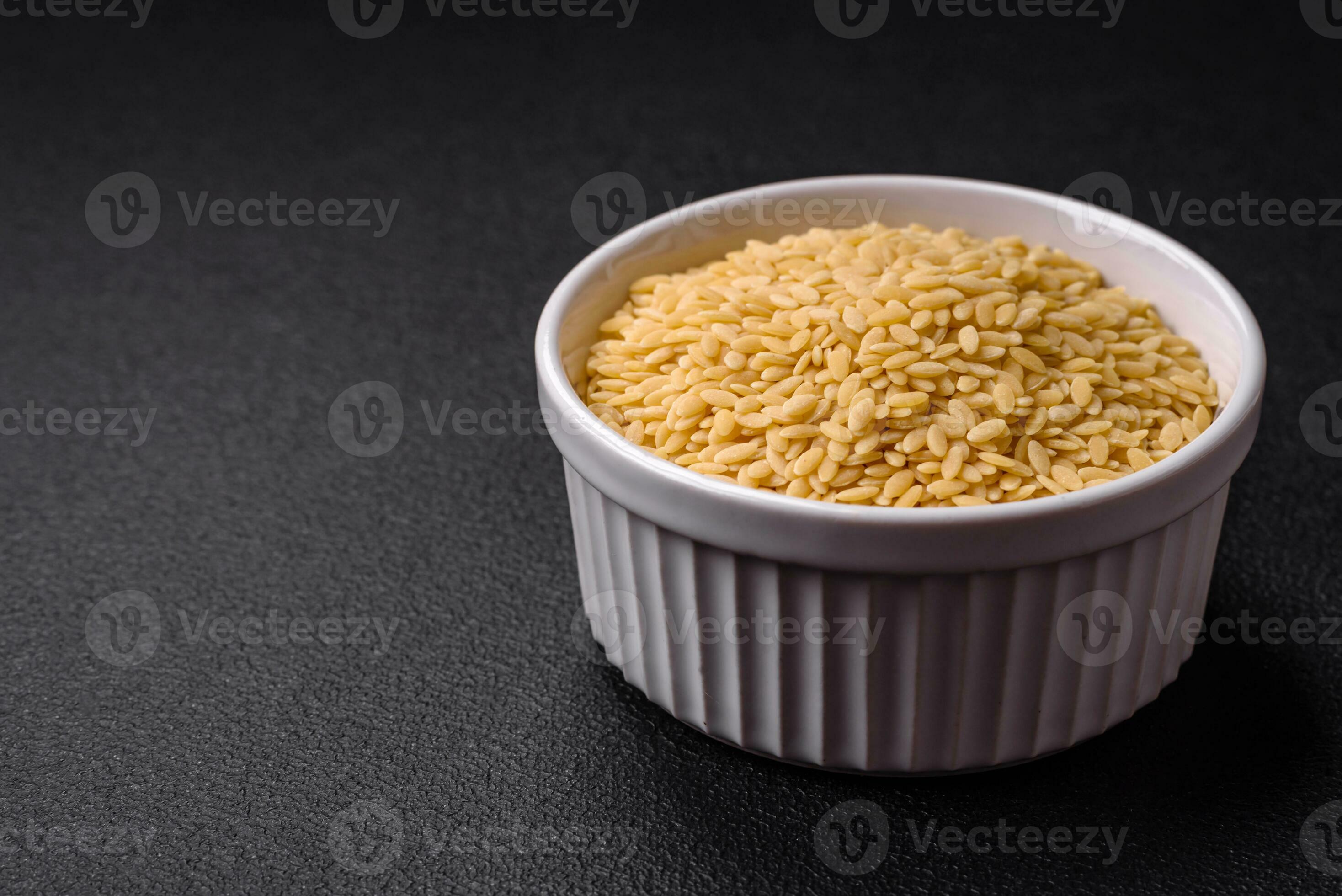 Raw whole grain orzo pasta as an ingredient for a delicious dish