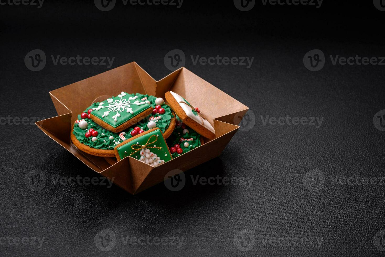 Beautiful festive Christmas gingerbread made by hand with decoration elements photo
