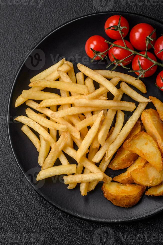 Fresh delicious crispy French fries with salt and spices photo