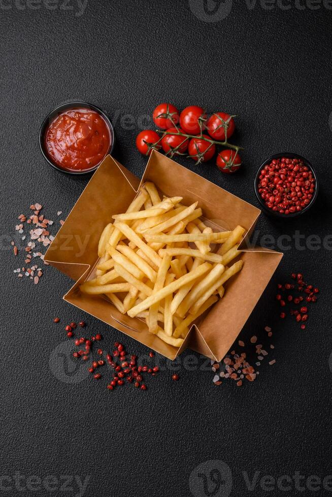 Fresh delicious crispy French fries with salt and spices photo