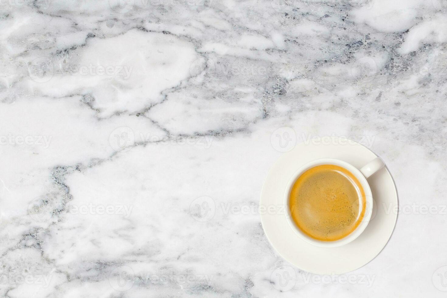 coffee cup on marble table background, top view. photo