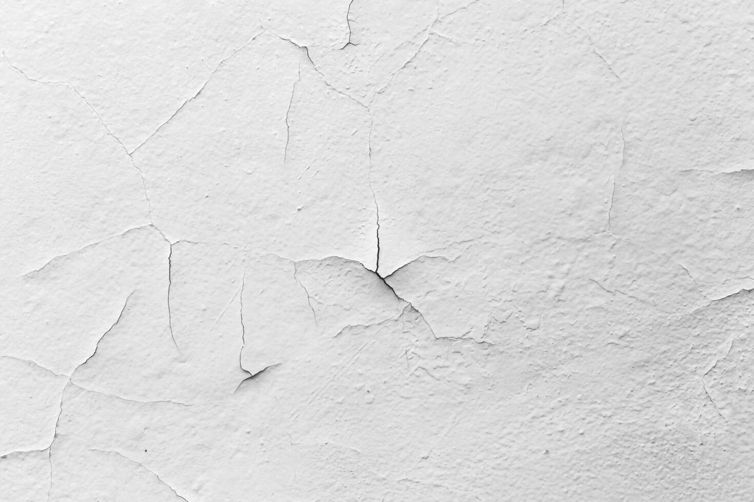 white wall with cracks photo