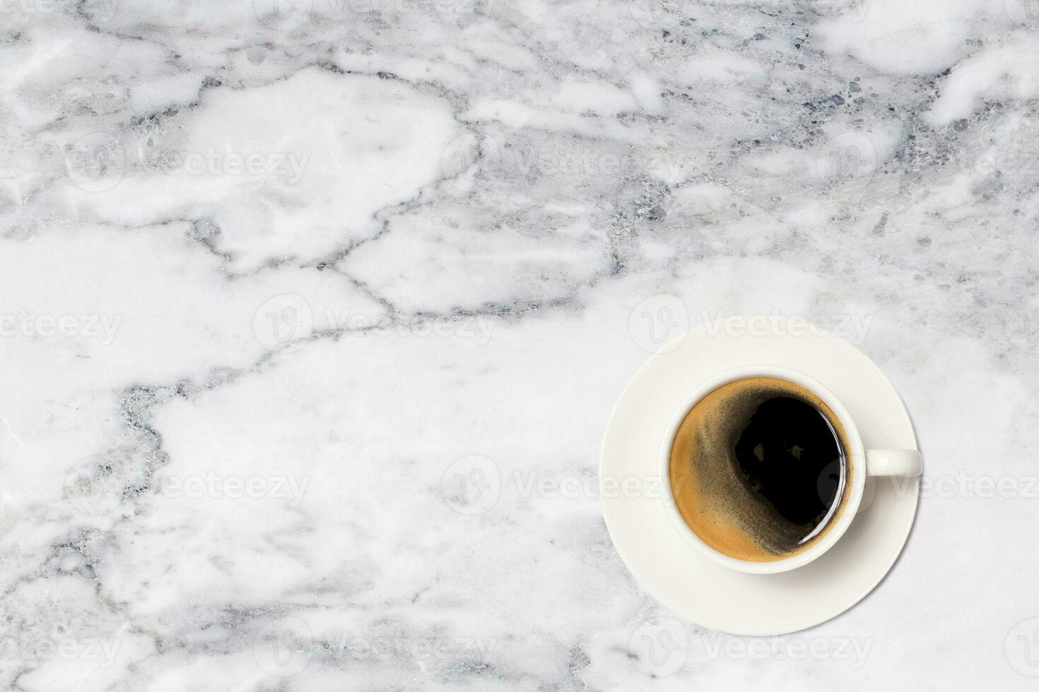 coffee cup on marble table background, top view. photo